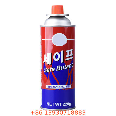 Butaangasfornuis-aerosolventiel met rode dop voor kamperen, picknicks en koken op tafel