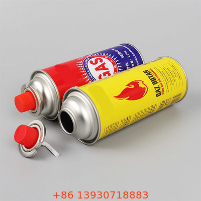 Butaangasfornuis-aerosolventiel met rode dop voor kamperen, picknicks en koken op tafel